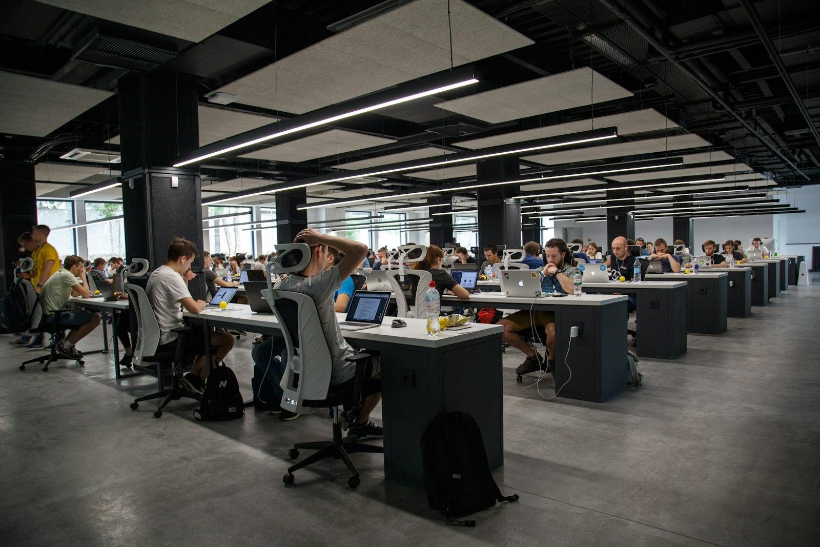 A large open-plan office full of people working at desks